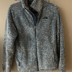 Brand new fuzzy North Face zip up jacket.
